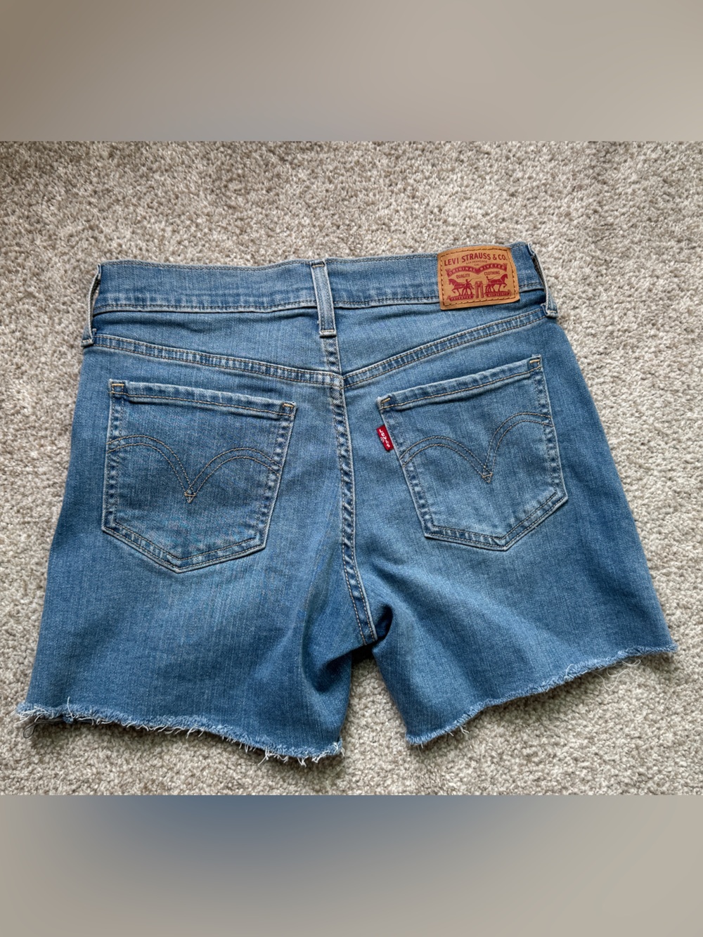 Levi's Medium Wash Frayed Hem Denim Shorts
